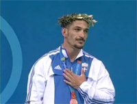 &Omicron;&lambda;&upsilon;&mu;&pi;&iota;&alpha;&kappa;&omicron;ί &alpha;&gamma;ώ&nu;&epsilon;&sigmaf; "&Pi;ά&nu;&tau;&omega;&nu; &chi;&rho;&eta;&mu;ά&tau;&omega;&nu; &mu;έ&tau;&rho;&omicron;&nu; ά&nu;&theta;&rho;&omega;&pi;&omicron;&sigmaf;